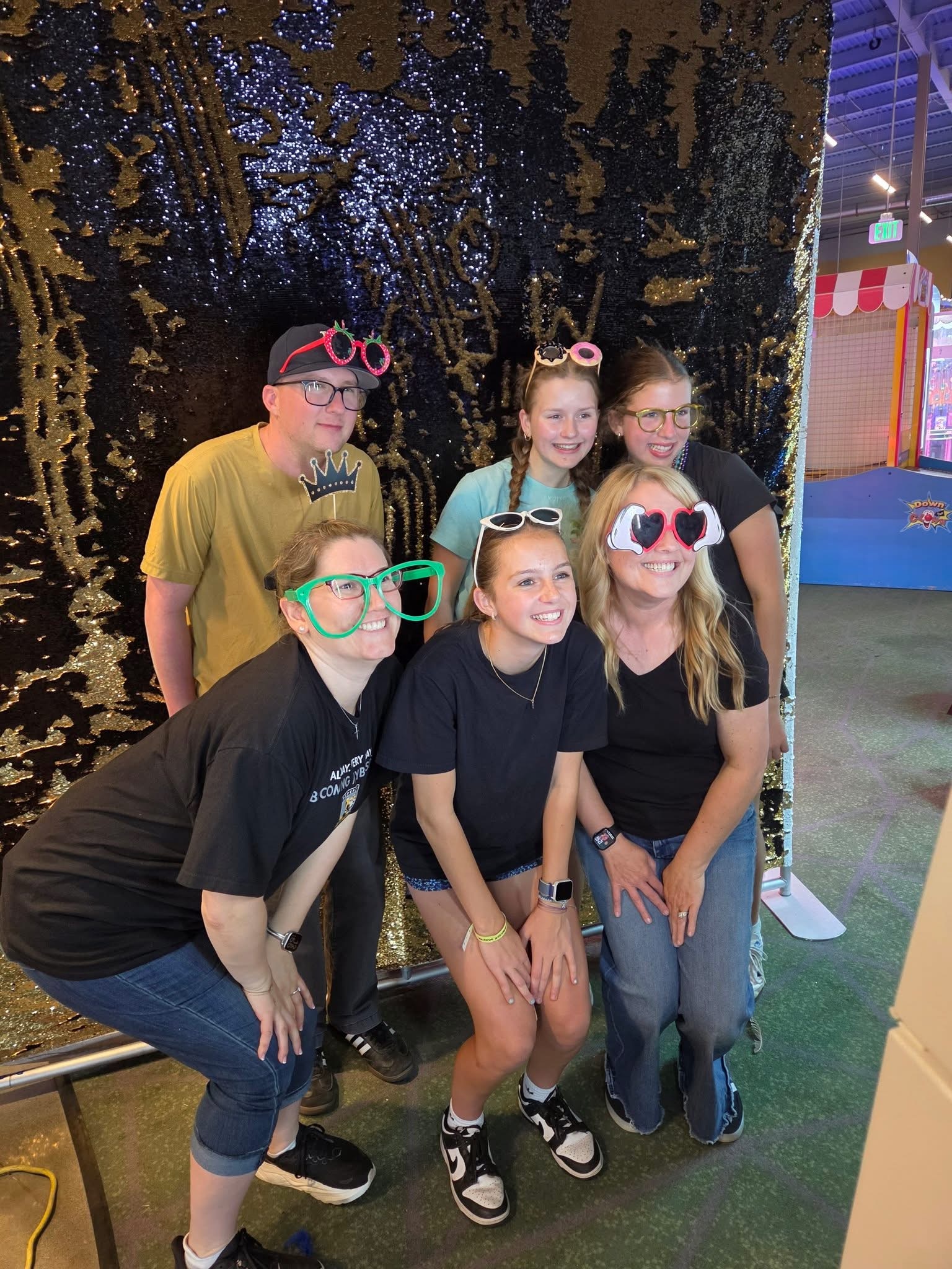 six middle schoolers in front of photobooth