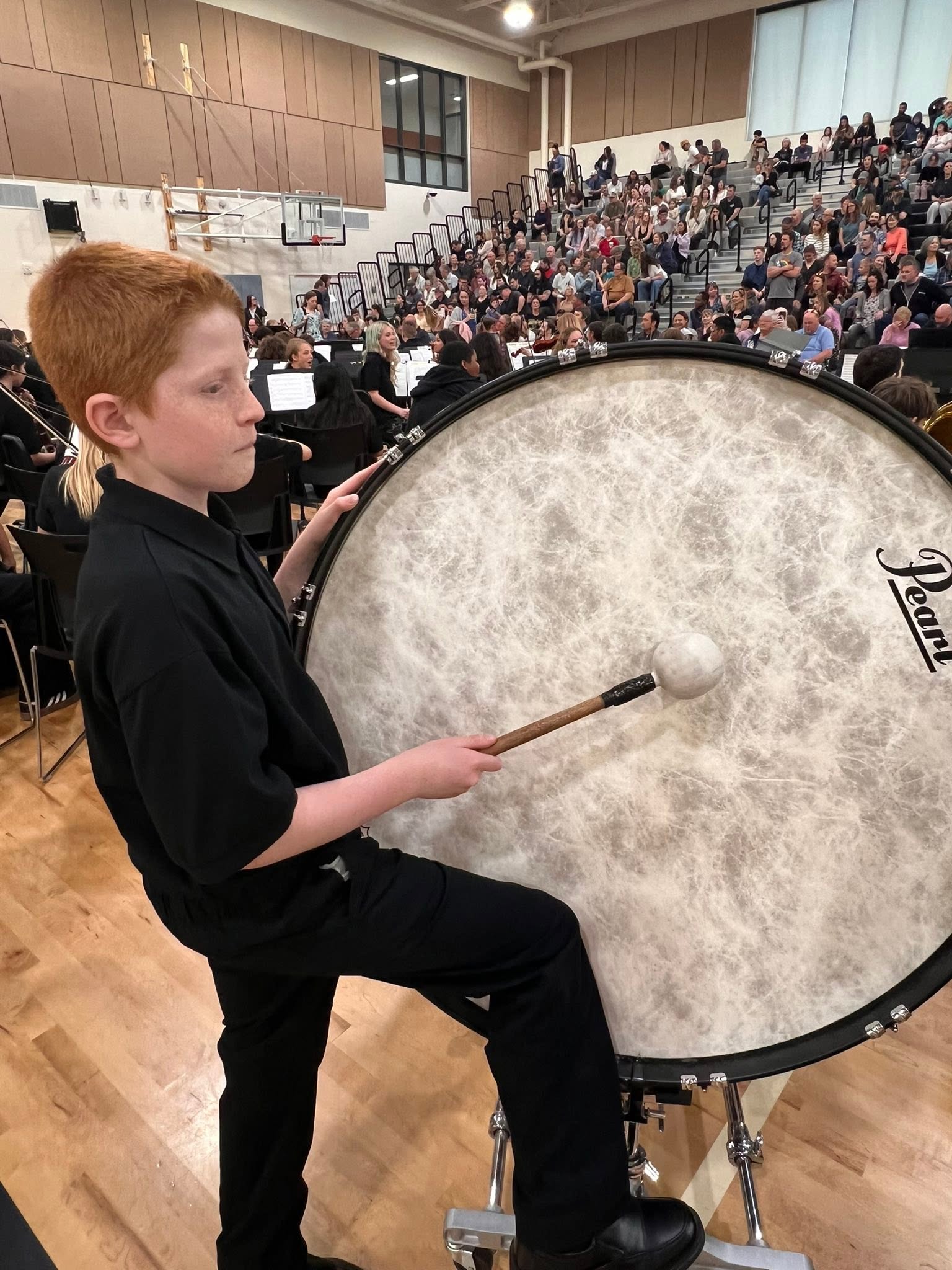 boy hitting drum