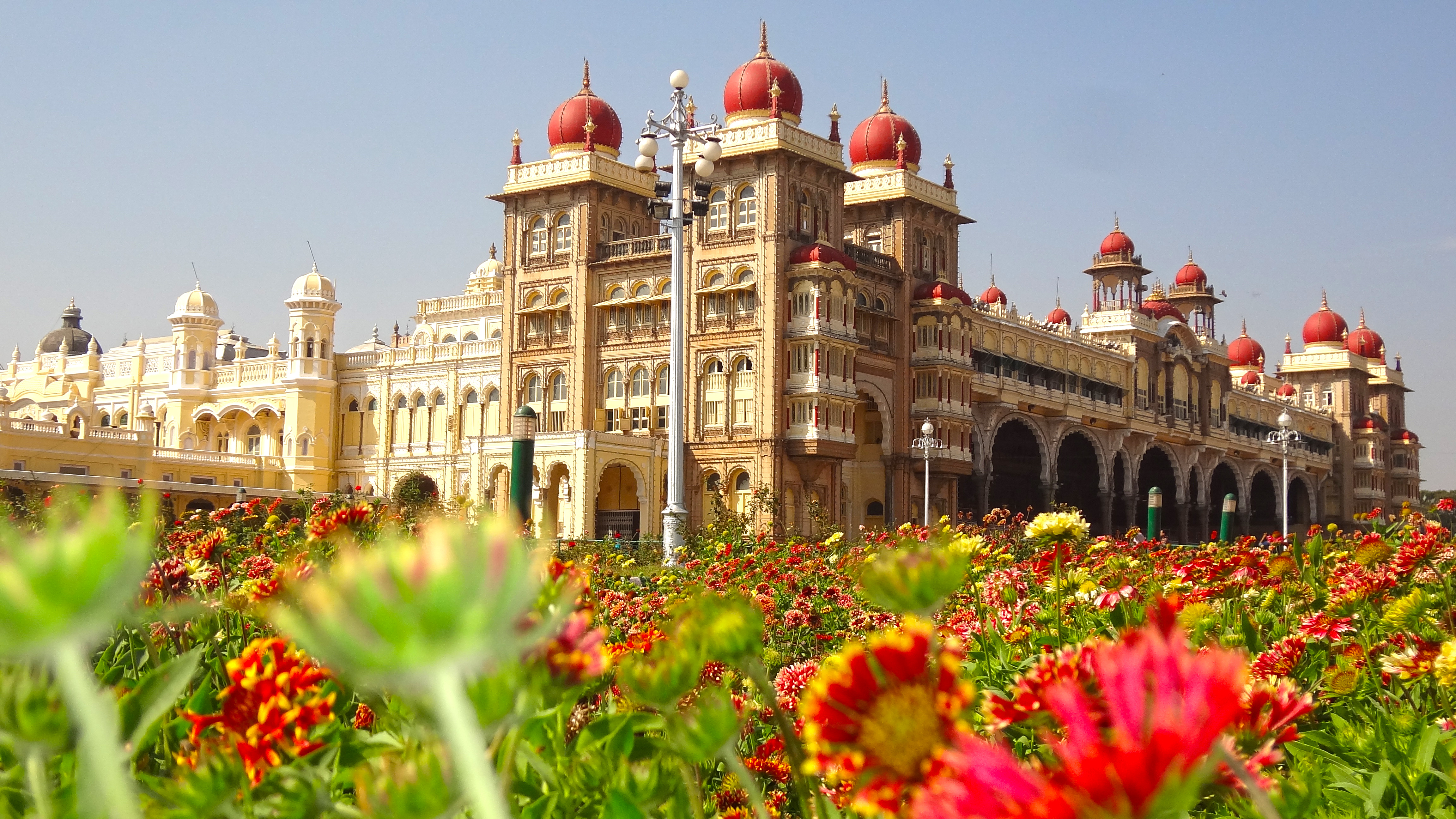 The iconic Mysore Palace illuminated at night.
