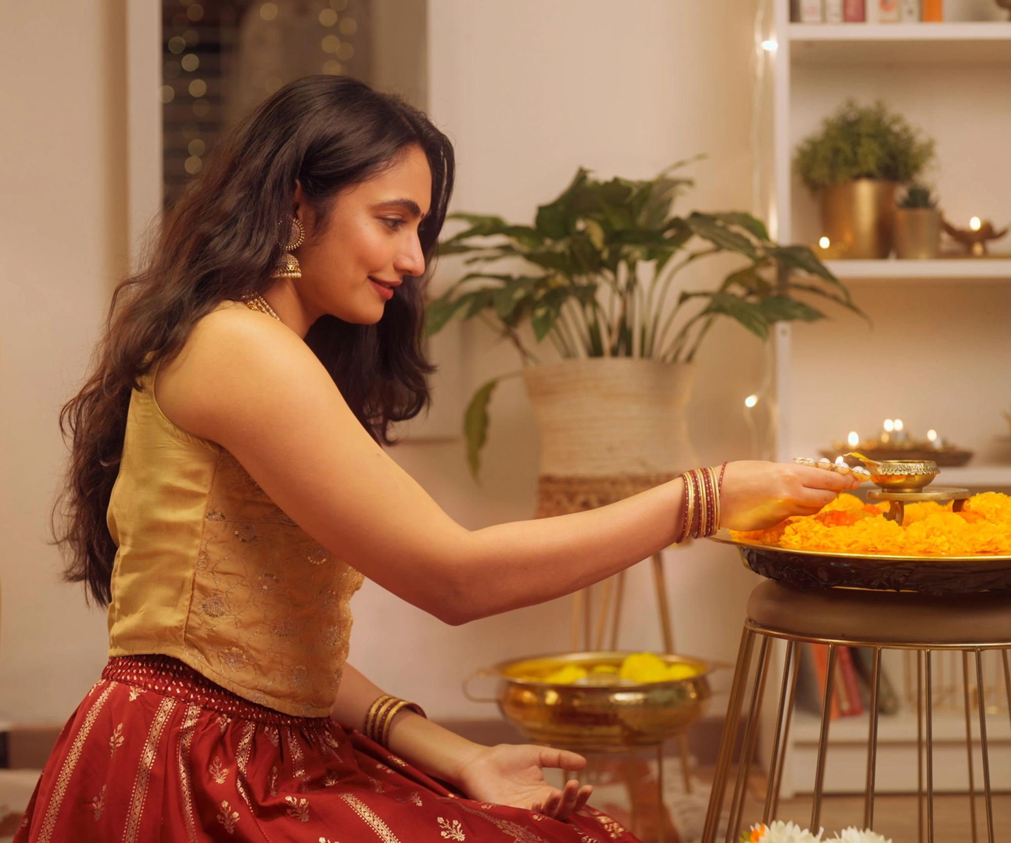 High quality campaign ready visual of a young woman lighting copper diyas, smiling and enjoying diwali festivities, Indian festival of lights
