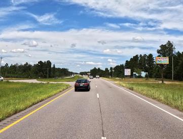 E/S HWY 59 3RD S/O CR 57 F/S