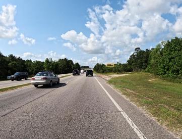 N/S HWY 90 W/O HALLS MILL CREEK F/NE