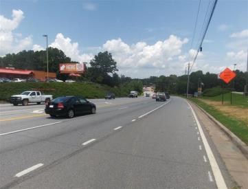S/S JIMMY CARTER .2 MI W/O PEACHTREE IND BLVD LHR F/E