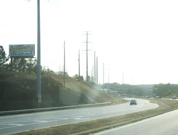 E/S PEACHTREE IND BLVD 1M N/O SR 20 LHR F/N