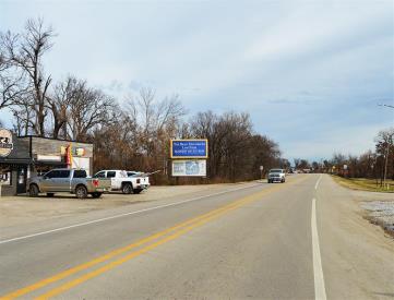 HWY 63 B 25' E/O 1ST ST NL W TOP F/W