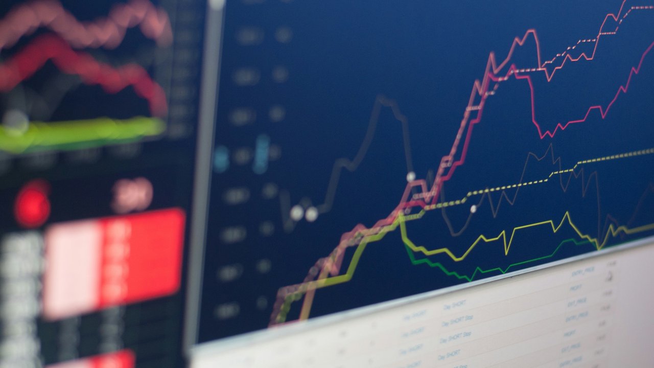 Close-up of a monitor displaying a line graph.