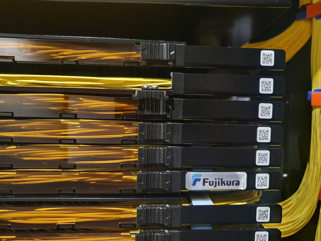 Trays of optical fibre cable in a network cabinet