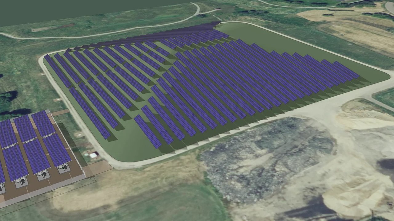An aerial rendering of a large solar panel array on a cleared site, with a battery storage installation at the left edge.