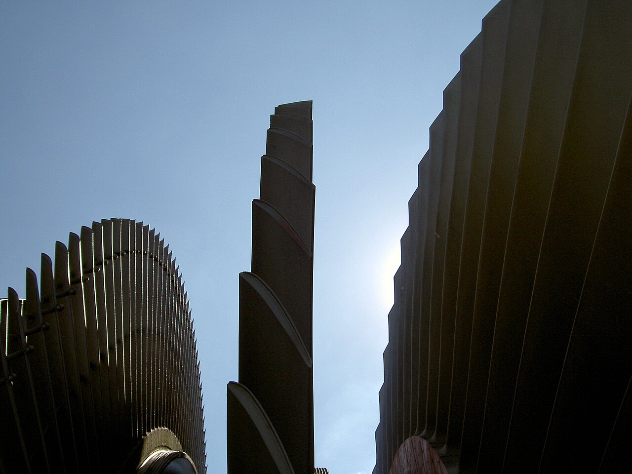 Large steam turbine blades seen against the sky