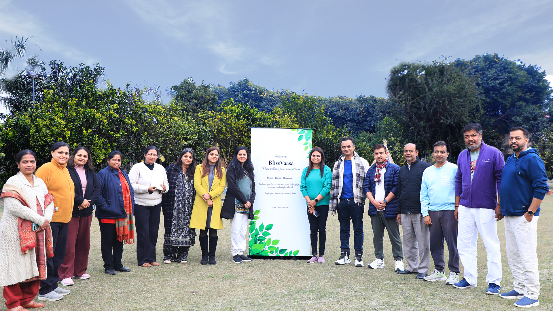 Group photo of attendees and organizers at the 'From Chaos to Calm' wellness event.