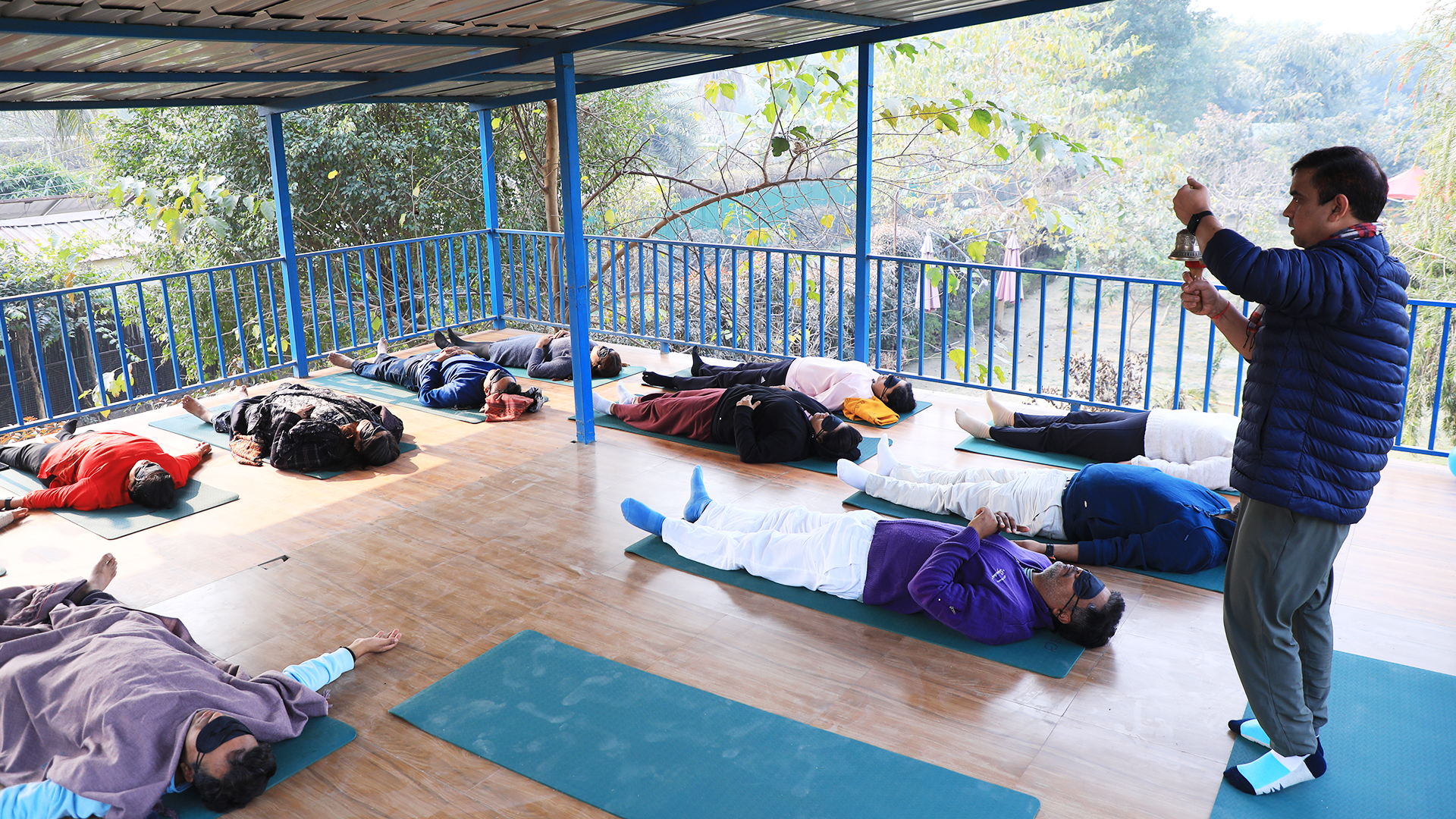 A person writing or drawing in a notebook during a reflective session.