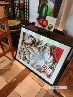 Vintage market stall with painted fish artwork and "30" price sign
