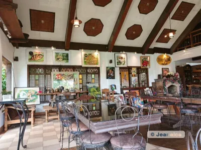 Heritage house interior with wooden ceiling panels and capiz windows