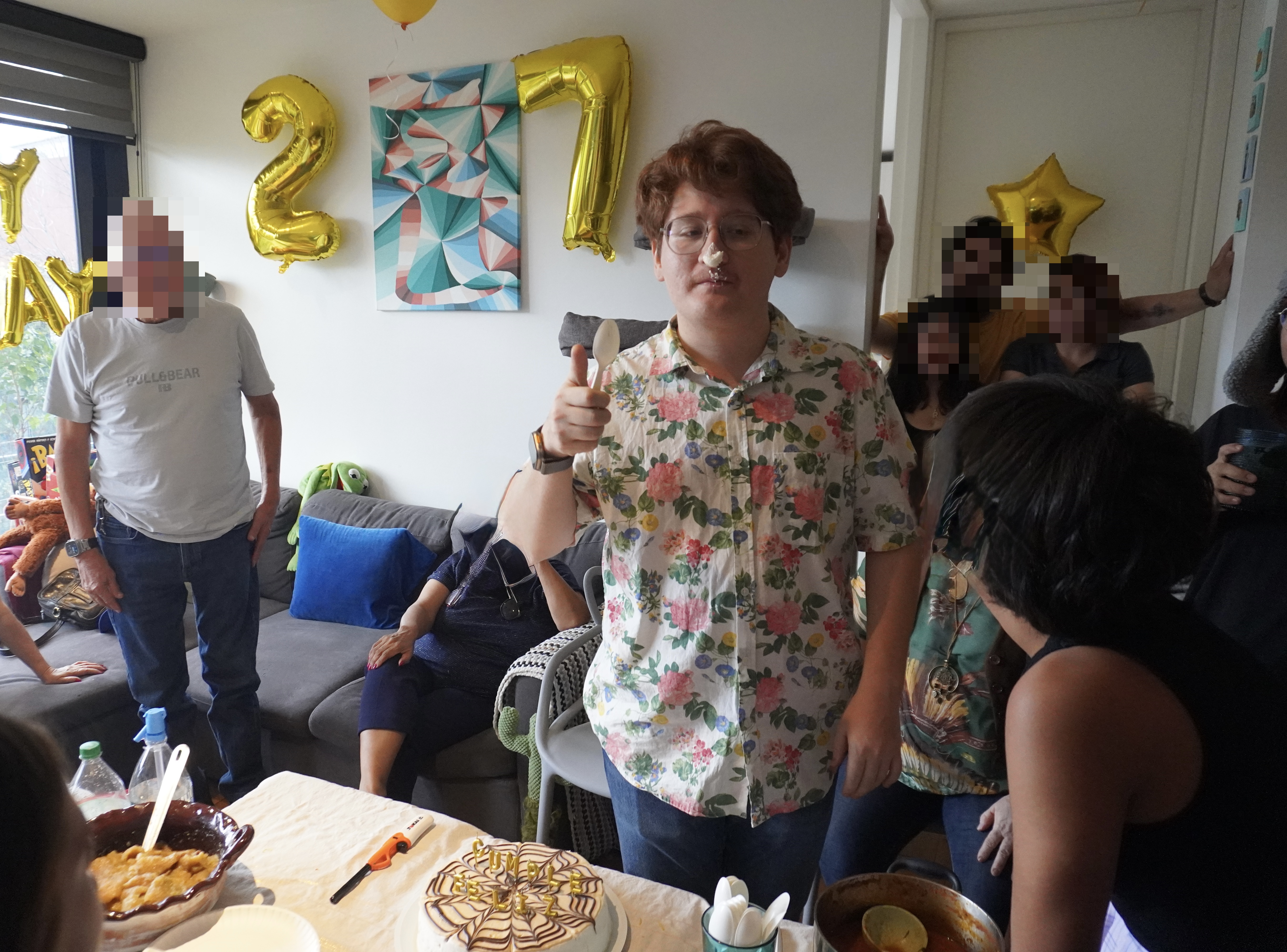 Picture of me with cake on the nose and people with filter on its faces looking at me