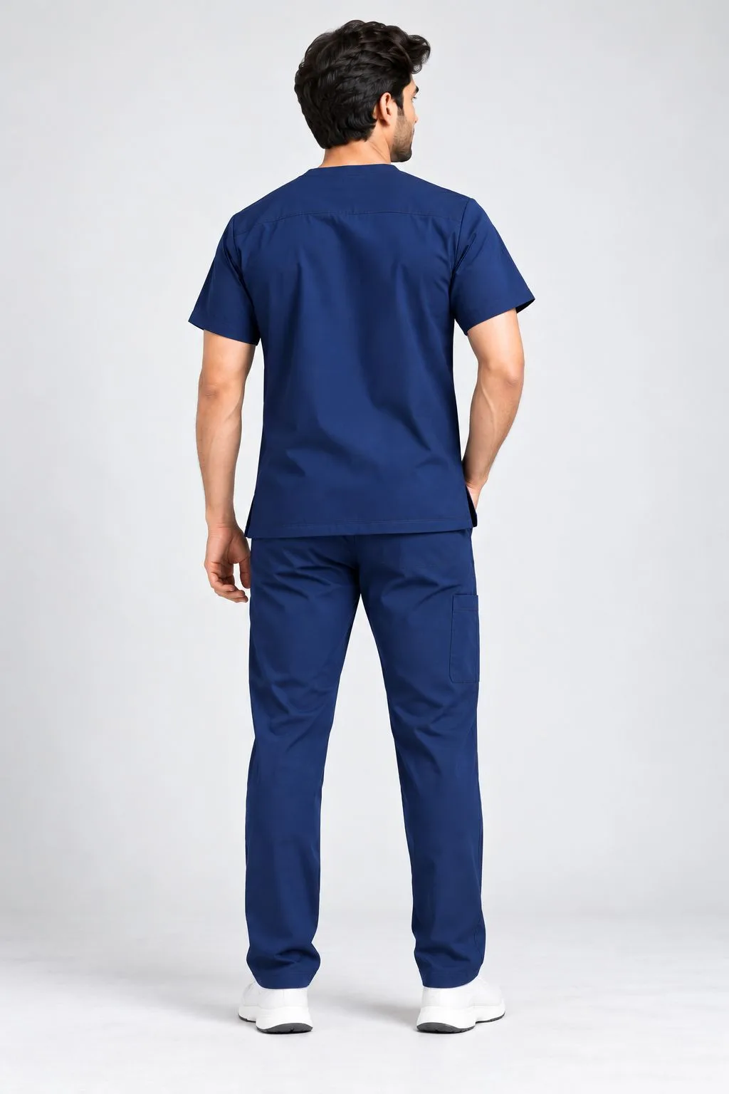 Navy blue medical scrub uniform with matching scrub trousers, back view