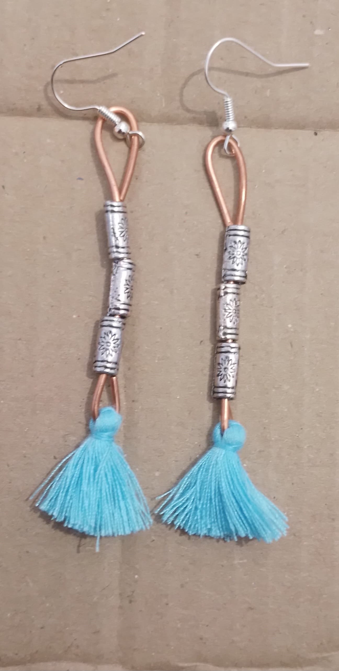 Adorned Copper With Blue Tassels