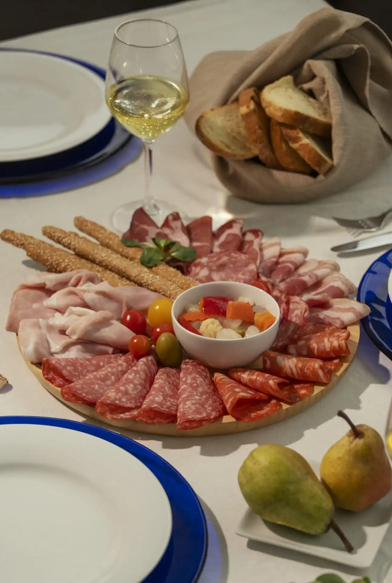 Bombieri cured meats platter with breadsticks and accompanying bread