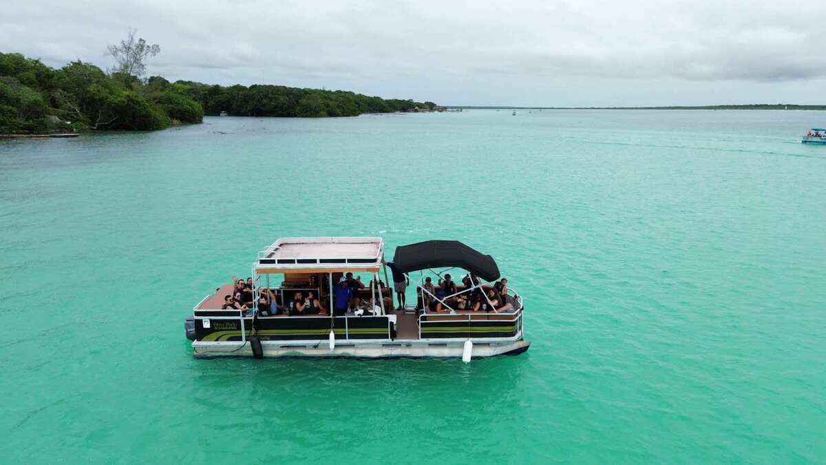 Pontoon boat ride through the turquoise waters of Bacalar
