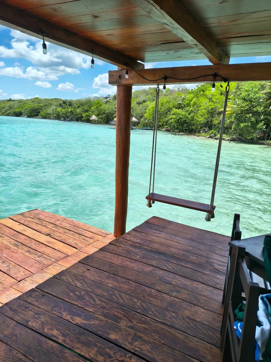 Famous swing over the crystal clear water of Bacalar