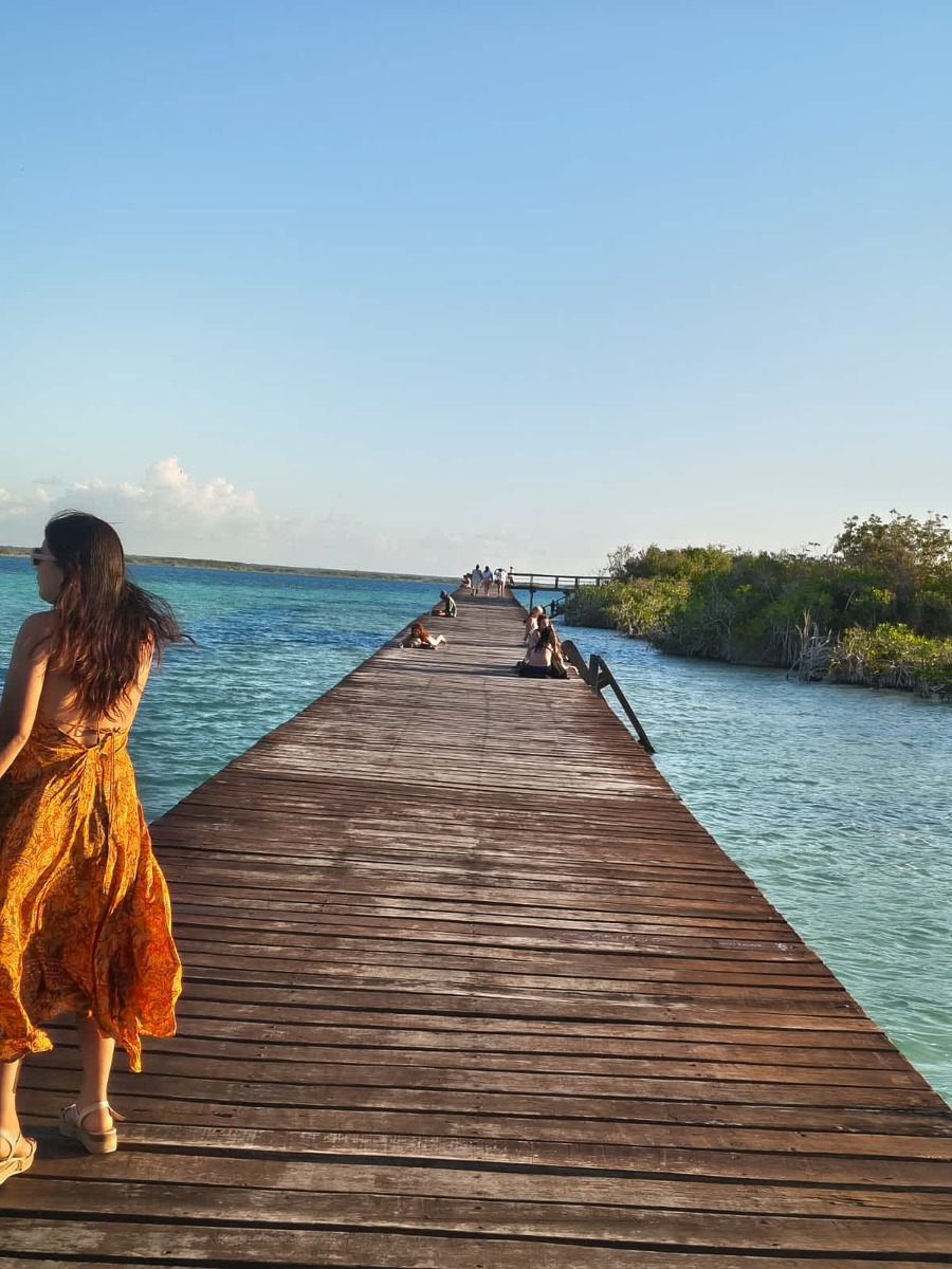 Wooden public dock over blue water