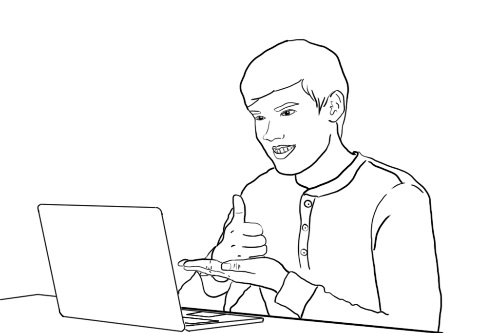 A Deaf South Asian student signs a message in front of a laptop computer.