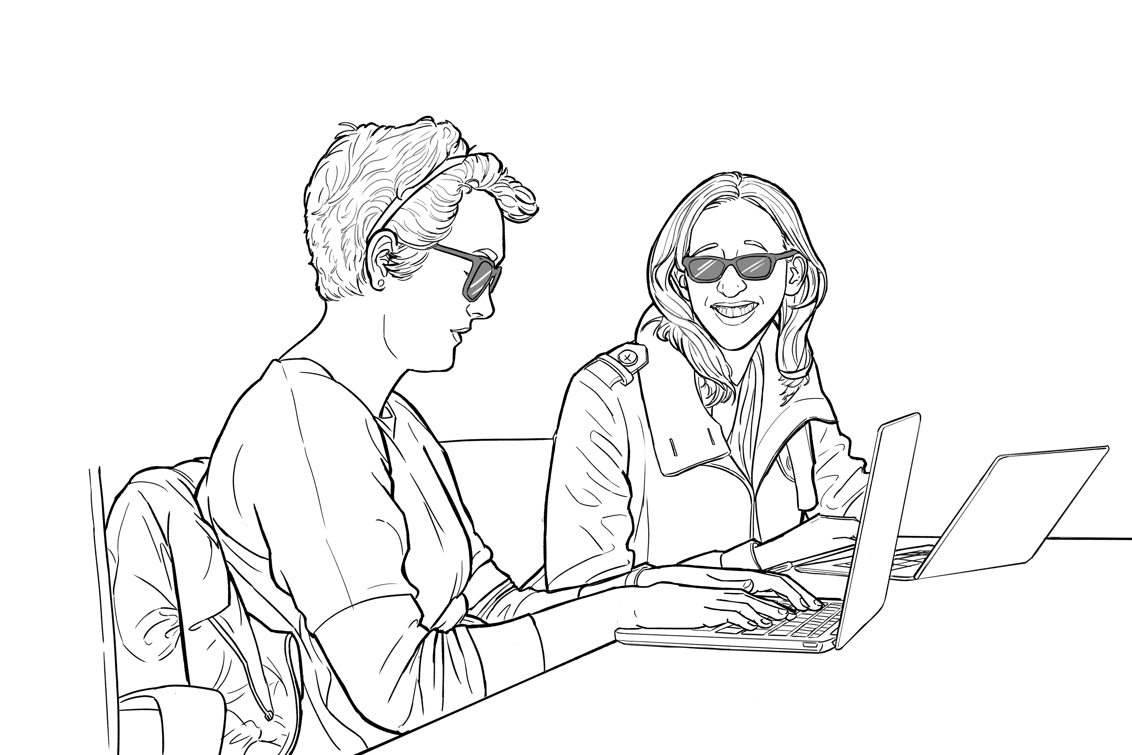 Two people on separate laptops, both with sunglasses, one smiling and the other typing.