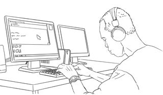 A blind person with headphones looking downward, using a desktop computer and a keyboard.