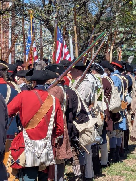 The color guard carries American flags at the commemoration