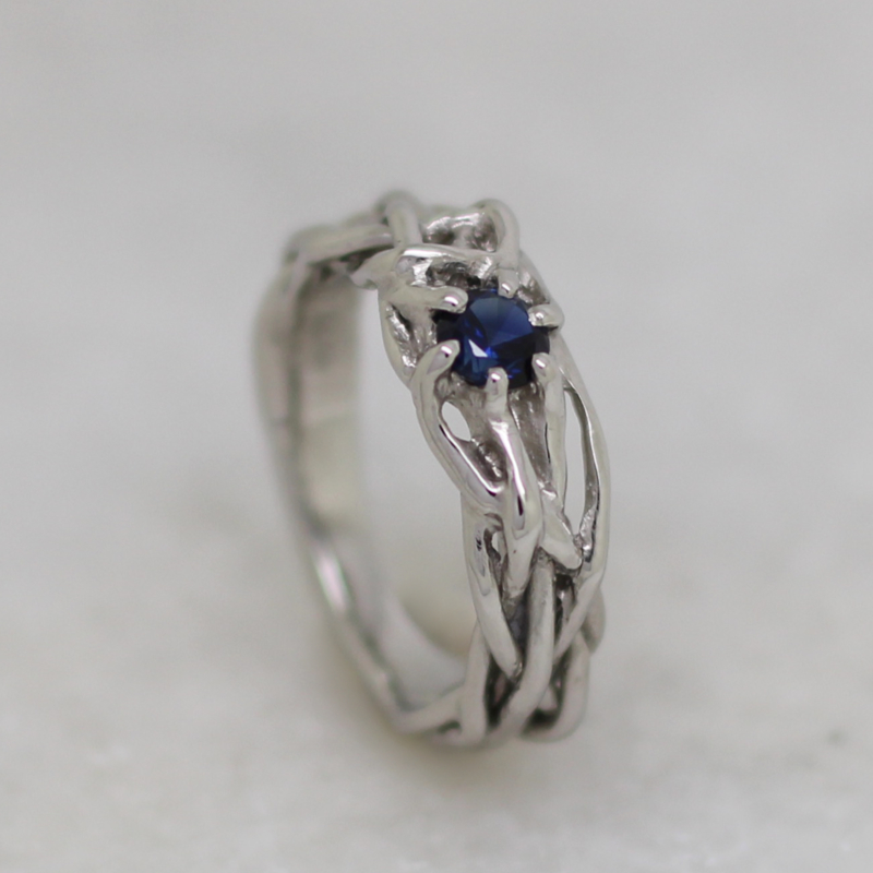 Braided ring set with blue sapphire