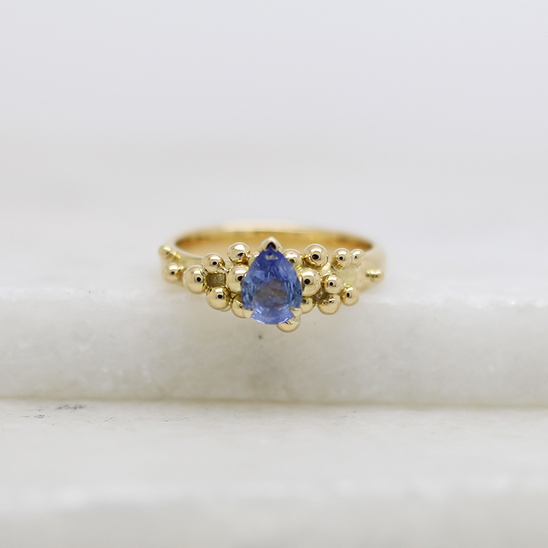 Pear shape sapphire and gold granulation ring