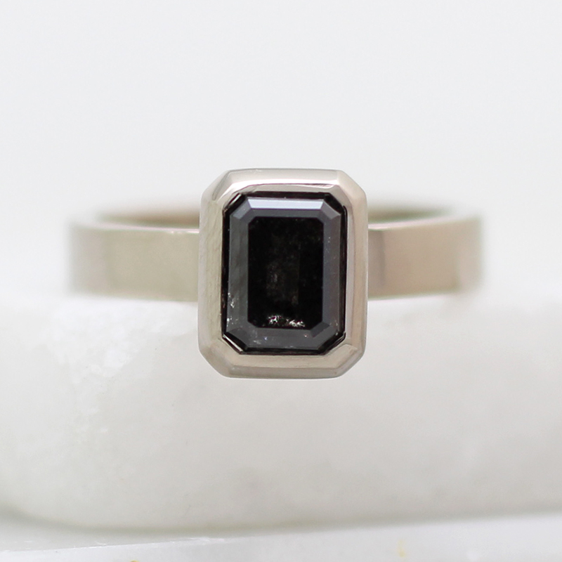 White gold ring set with salt & pepper diamond