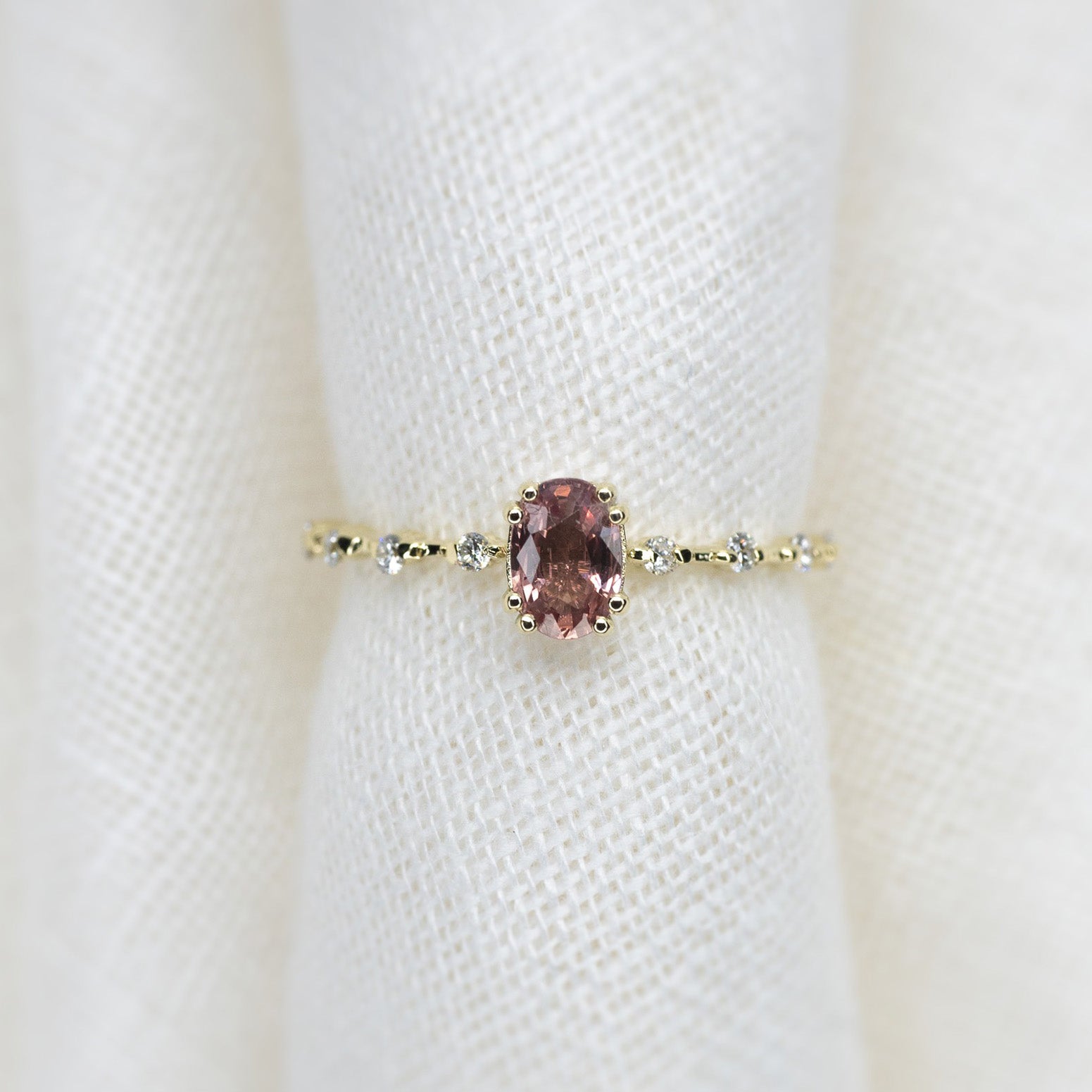 Oval Cut 0.51ct Padparadscha Sapphire Aurora Ice