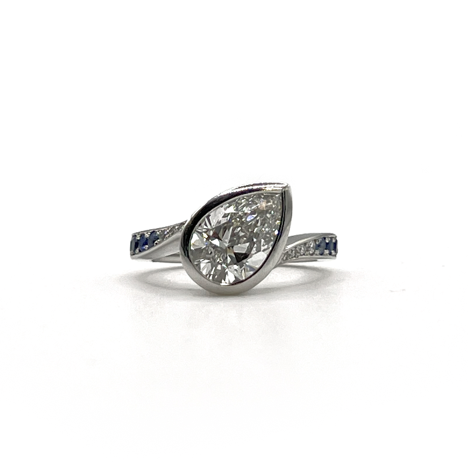 Tidal Pear Shaped Diamond, Platinum & Sapphire Ring