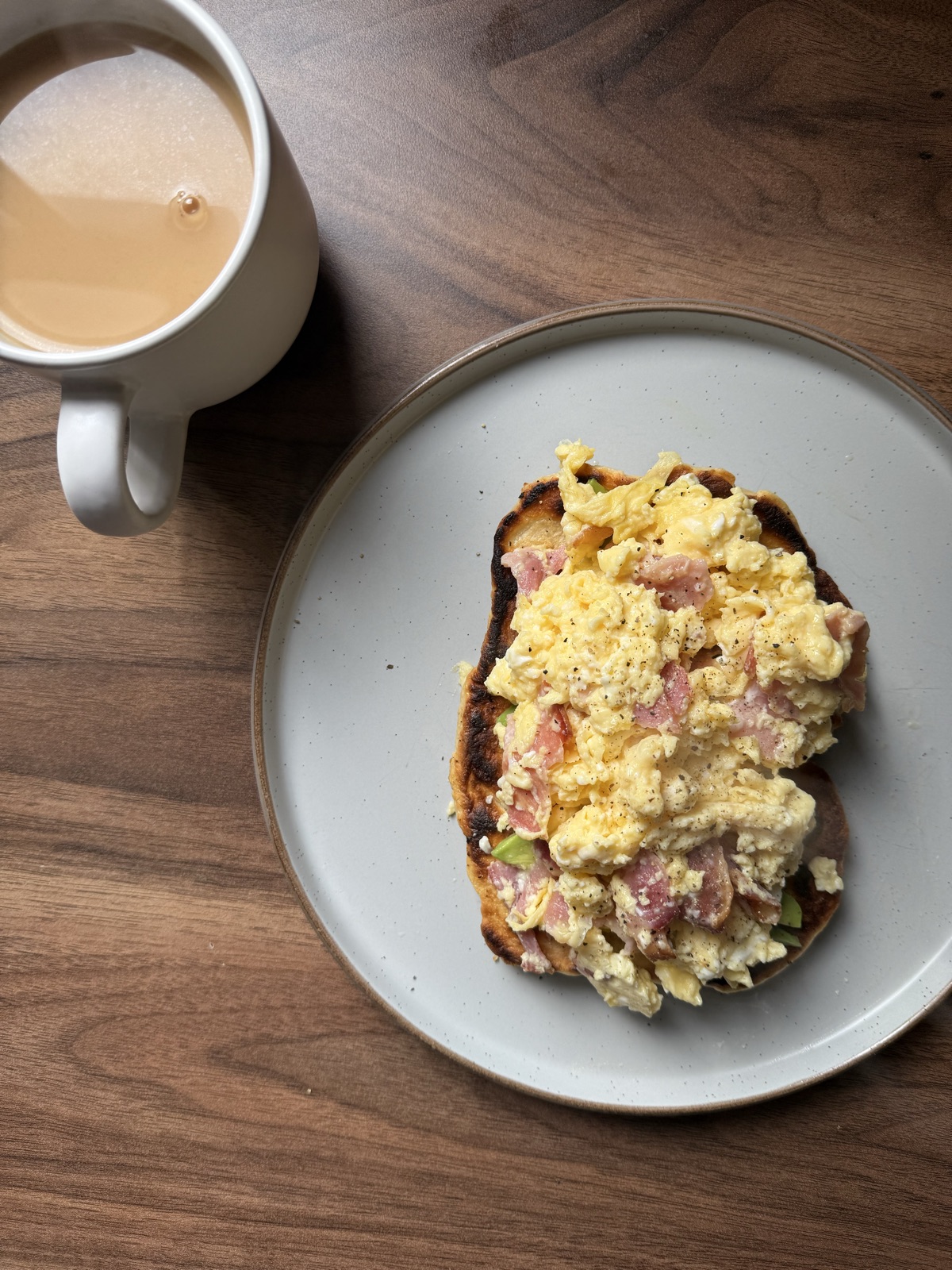 Homemade flatbread with bacon, avocado and scrambled egg