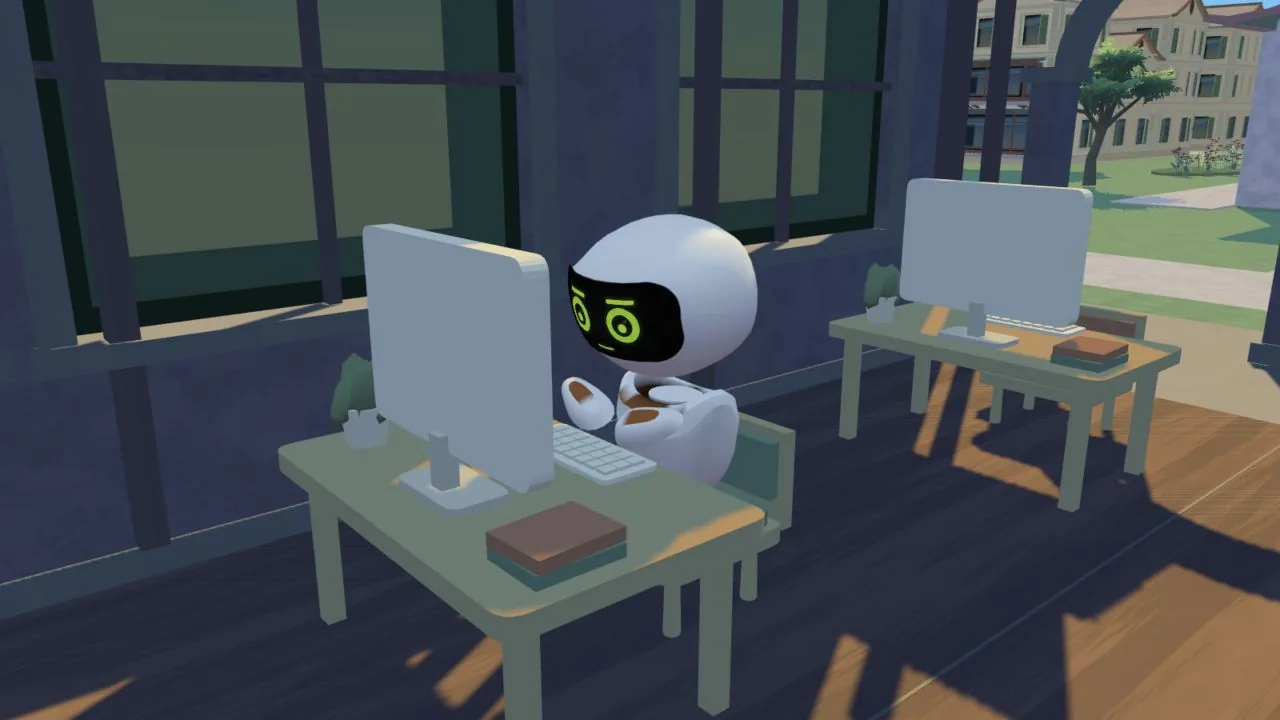 A Chippu seated at a computer in The Office.