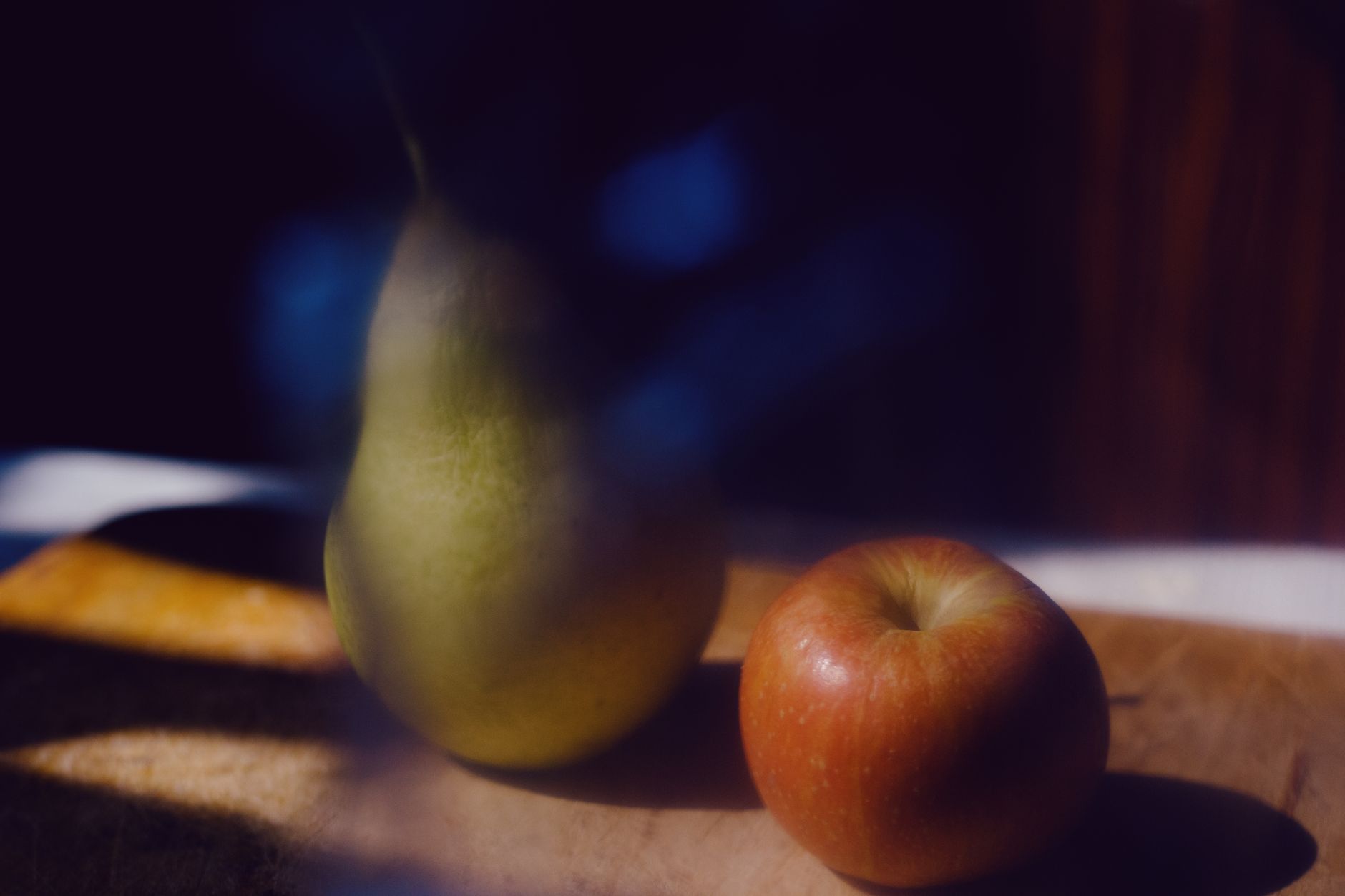A small apple next to a kitchen scale, showing the approximate weight of a 14-week fetus