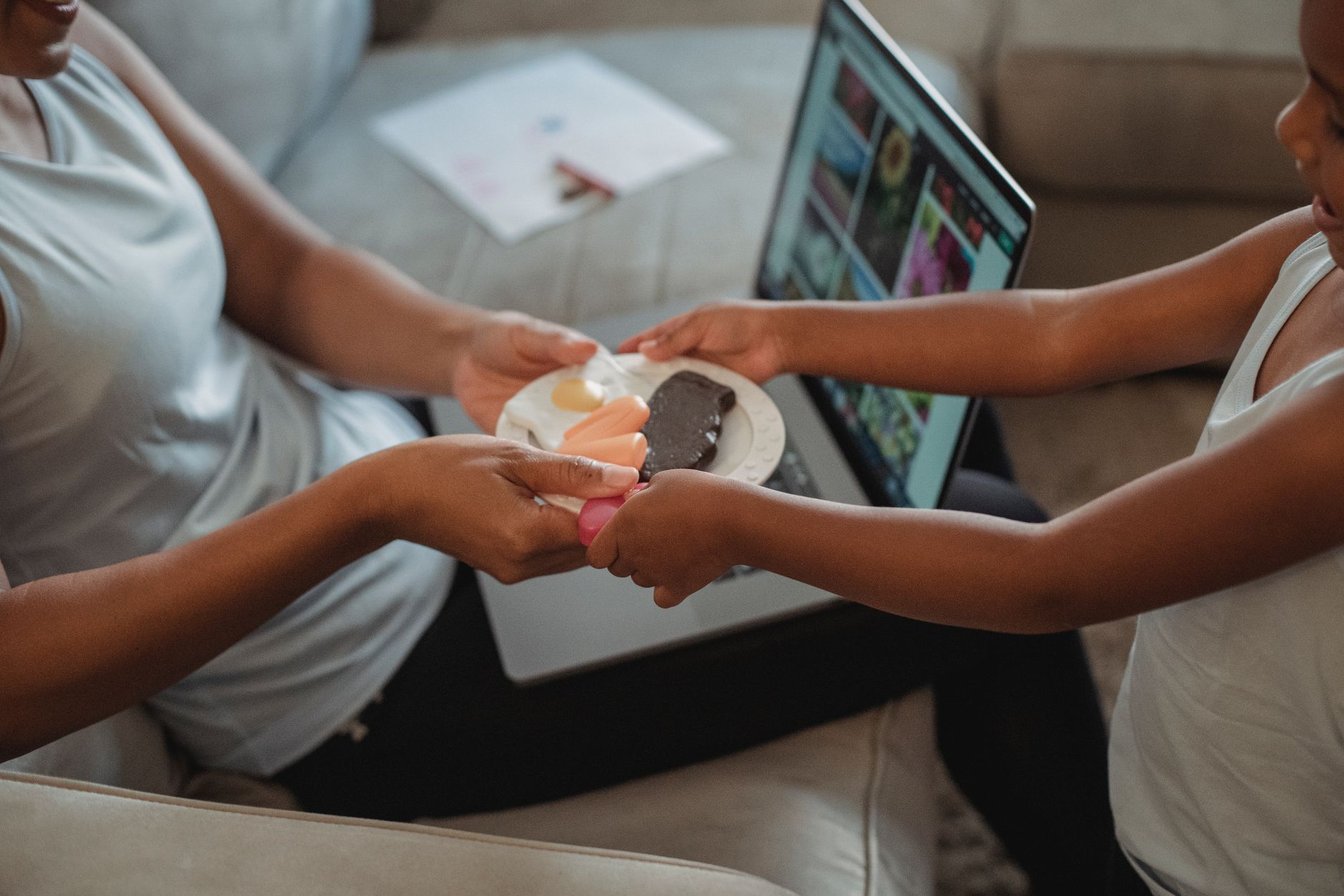 Parent engaging toddler in a mealtime activity