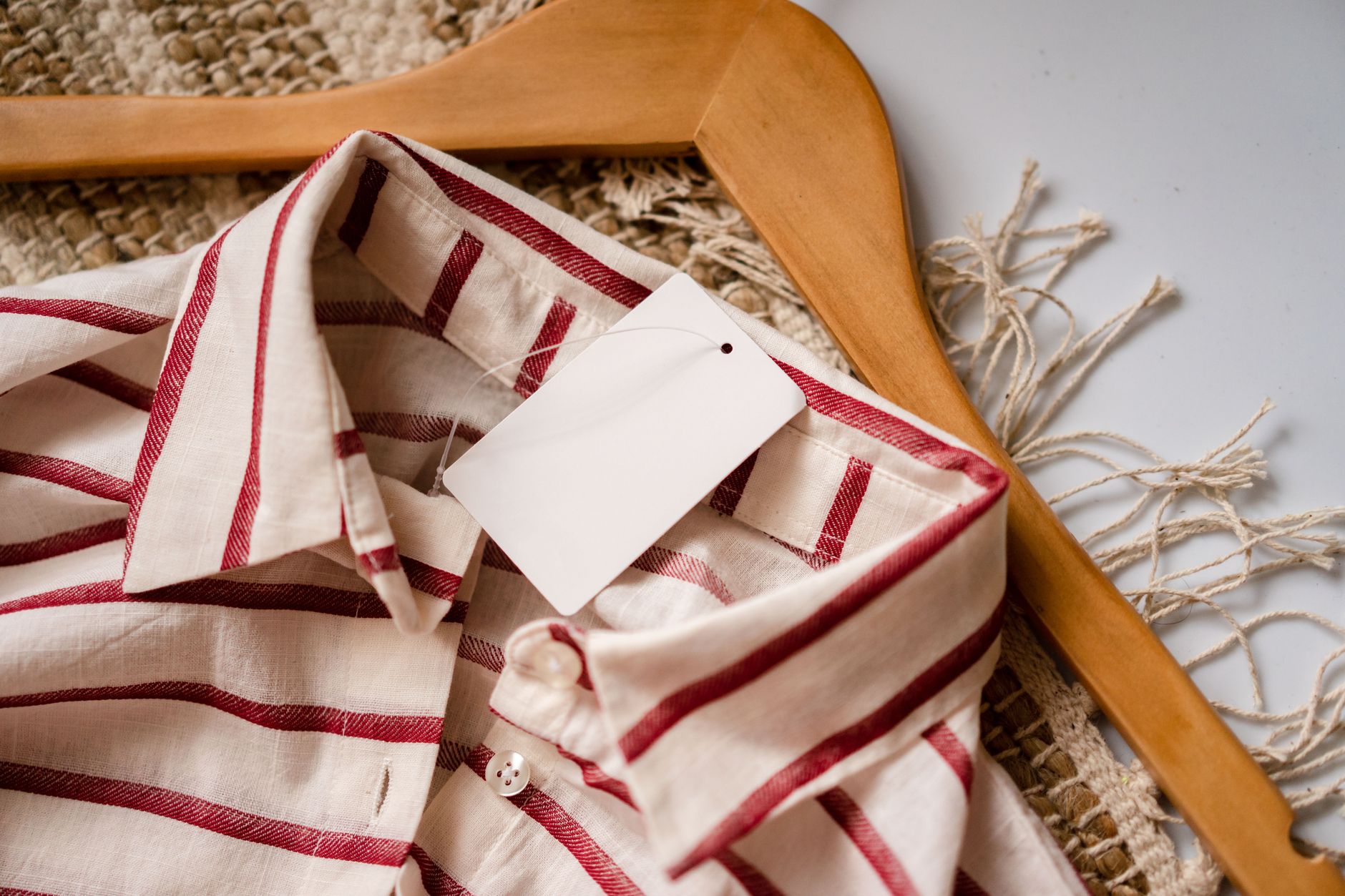 Comfortable maternity outfit laid out on a wooden table, soft pastel colors, natural light highlighting the fabric texture
