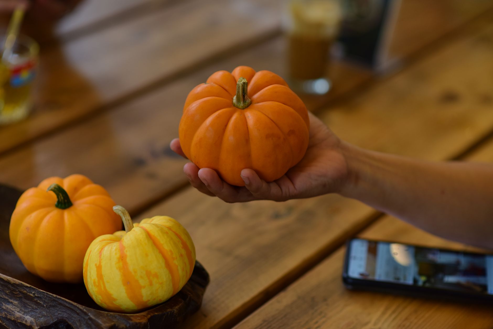 A comparison of a small watermelon and a large pumpkin to show the size difference between 40-week and 42-week babies