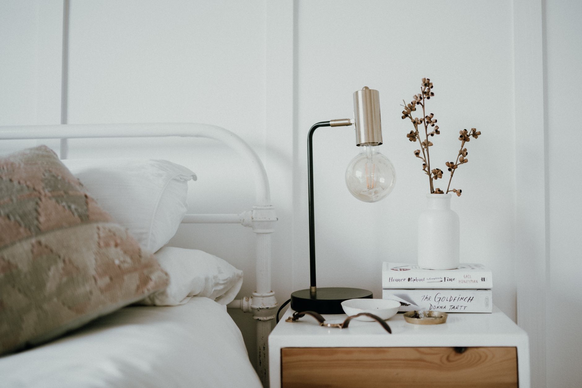 Nighttime heartburn prevention items on a bedside table