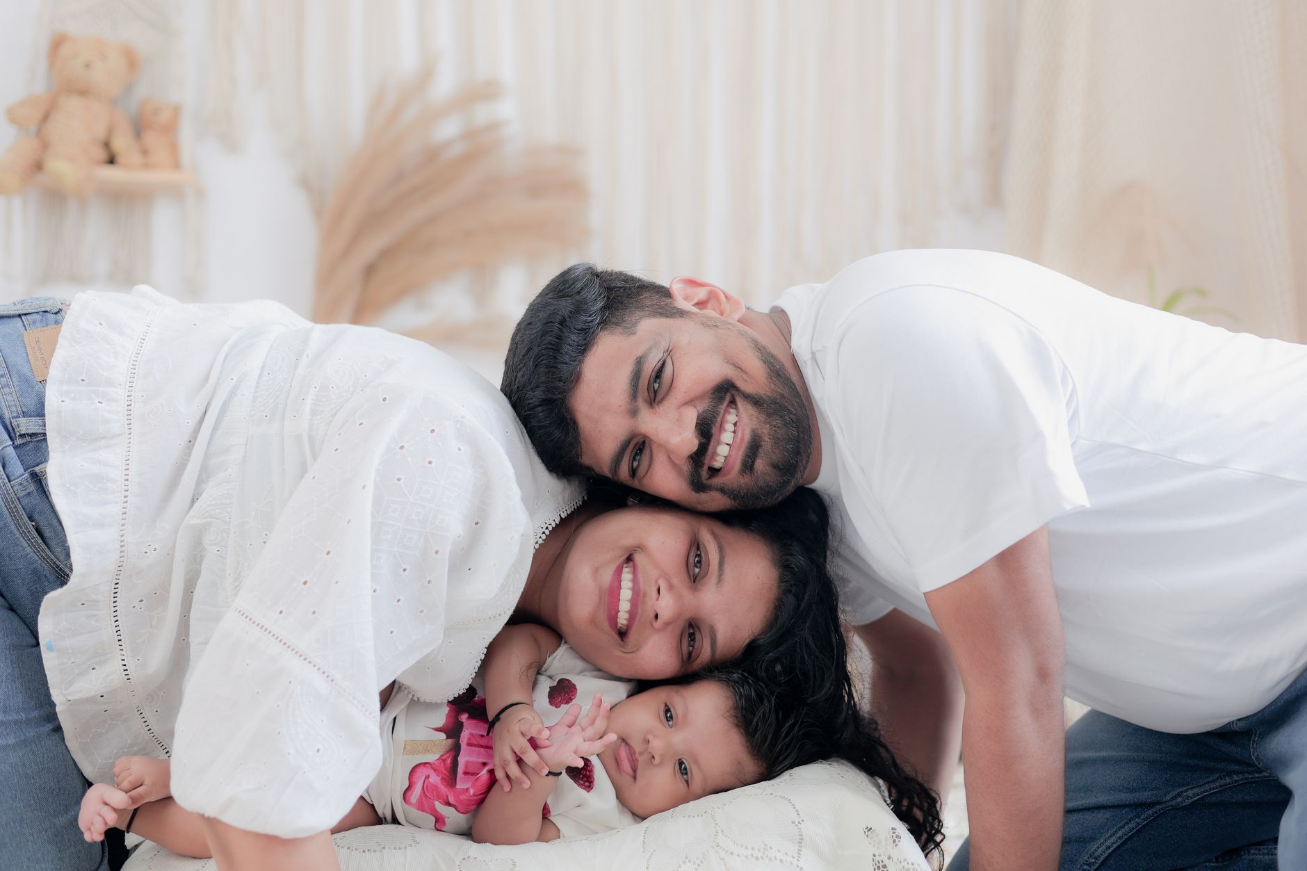 Family cuddling on sofa