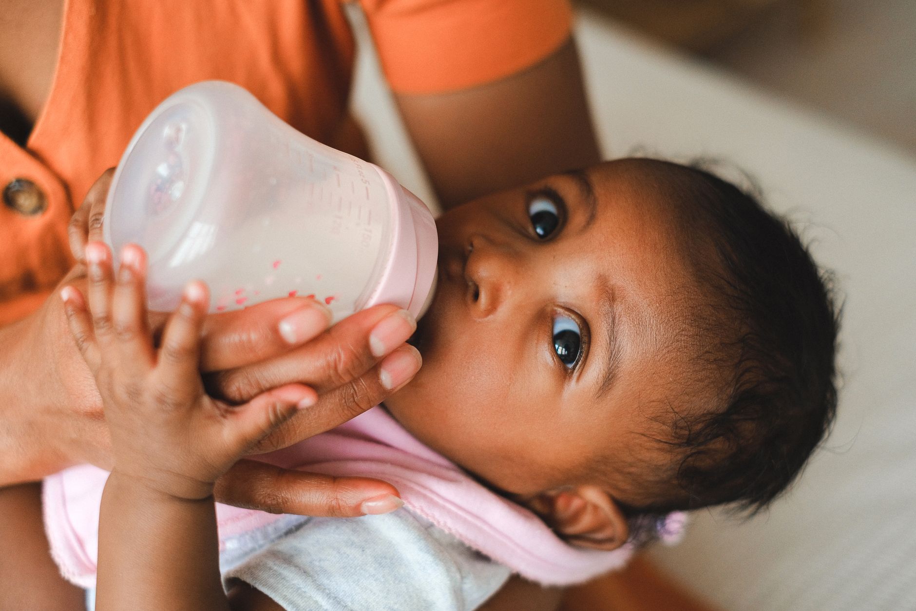 Parent using dosing chart for infant medication