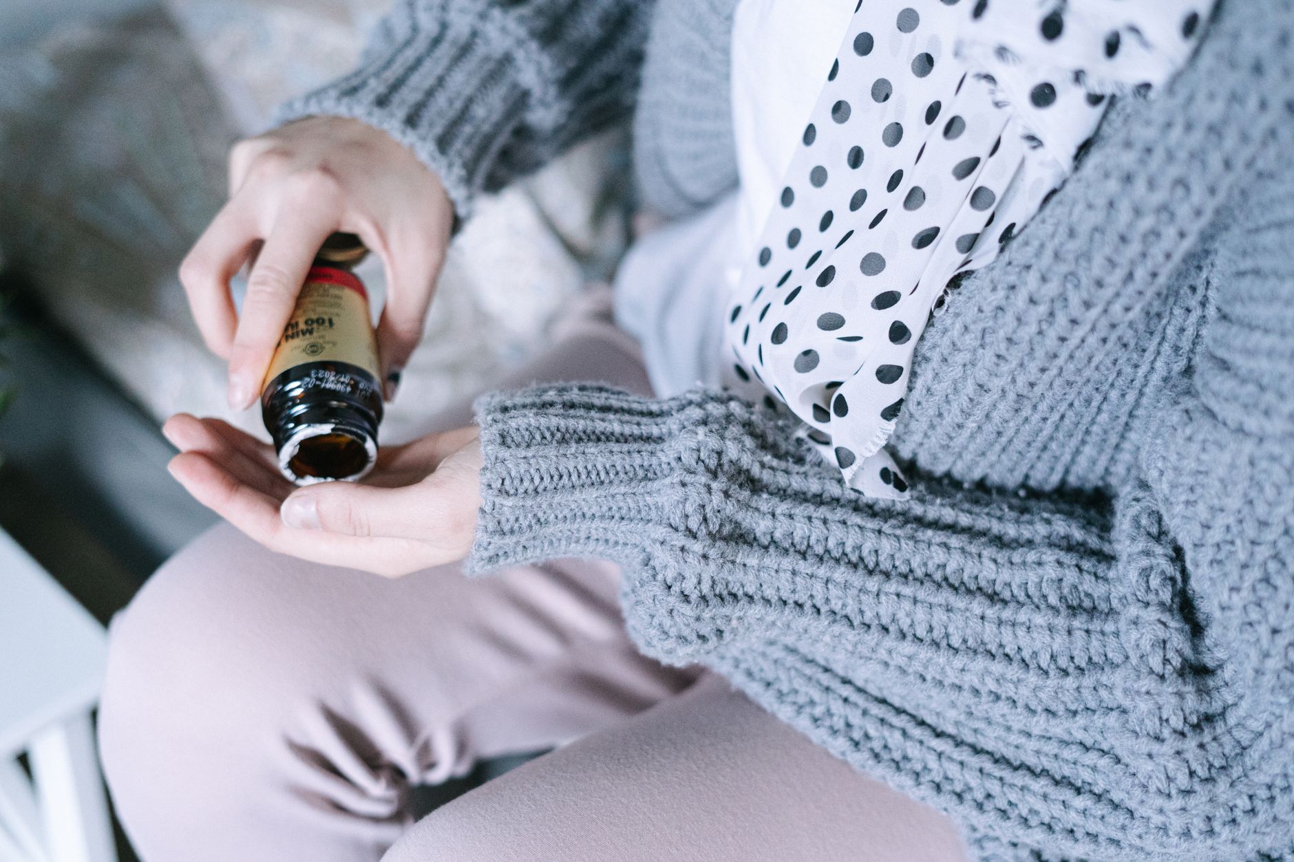 a close‑up of a labeled bottle of amoxicillin tablets beside a prenatal vitamin bottle, with soft daylight highlighting the medication safety for pregnant women