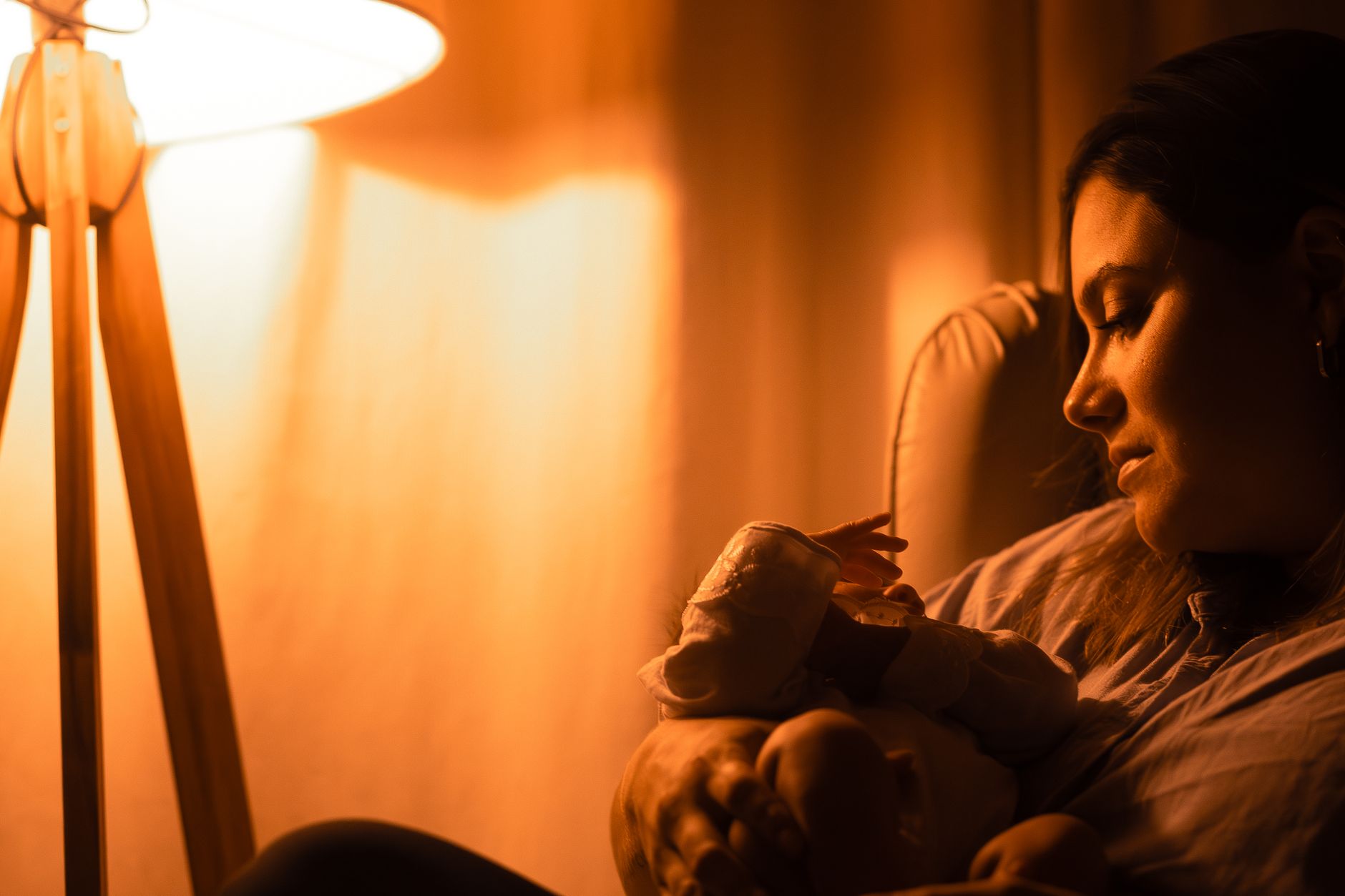 Mother soothing baby at bedtime