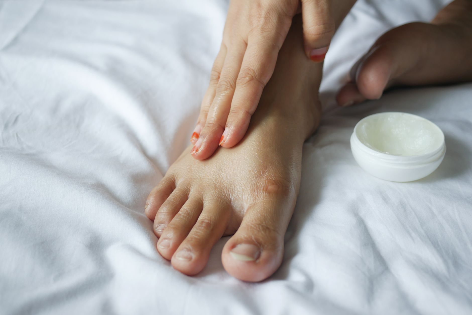 Applying petroleum jelly to baby's skin