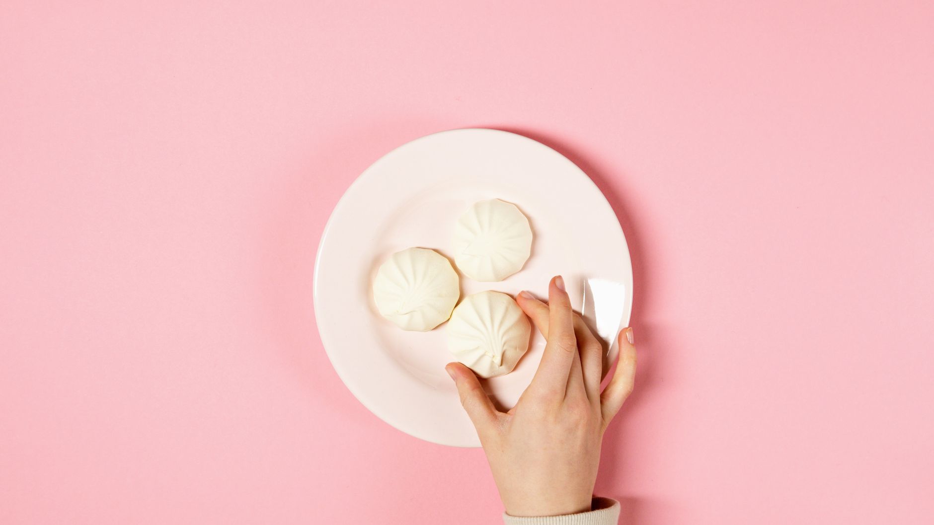 Close‑up of a colorful plate with soft‑cooked vegetable sticks, ripe banana slices, and a small scoop of oatmeal, ideal for an eight‑month‑old baby
