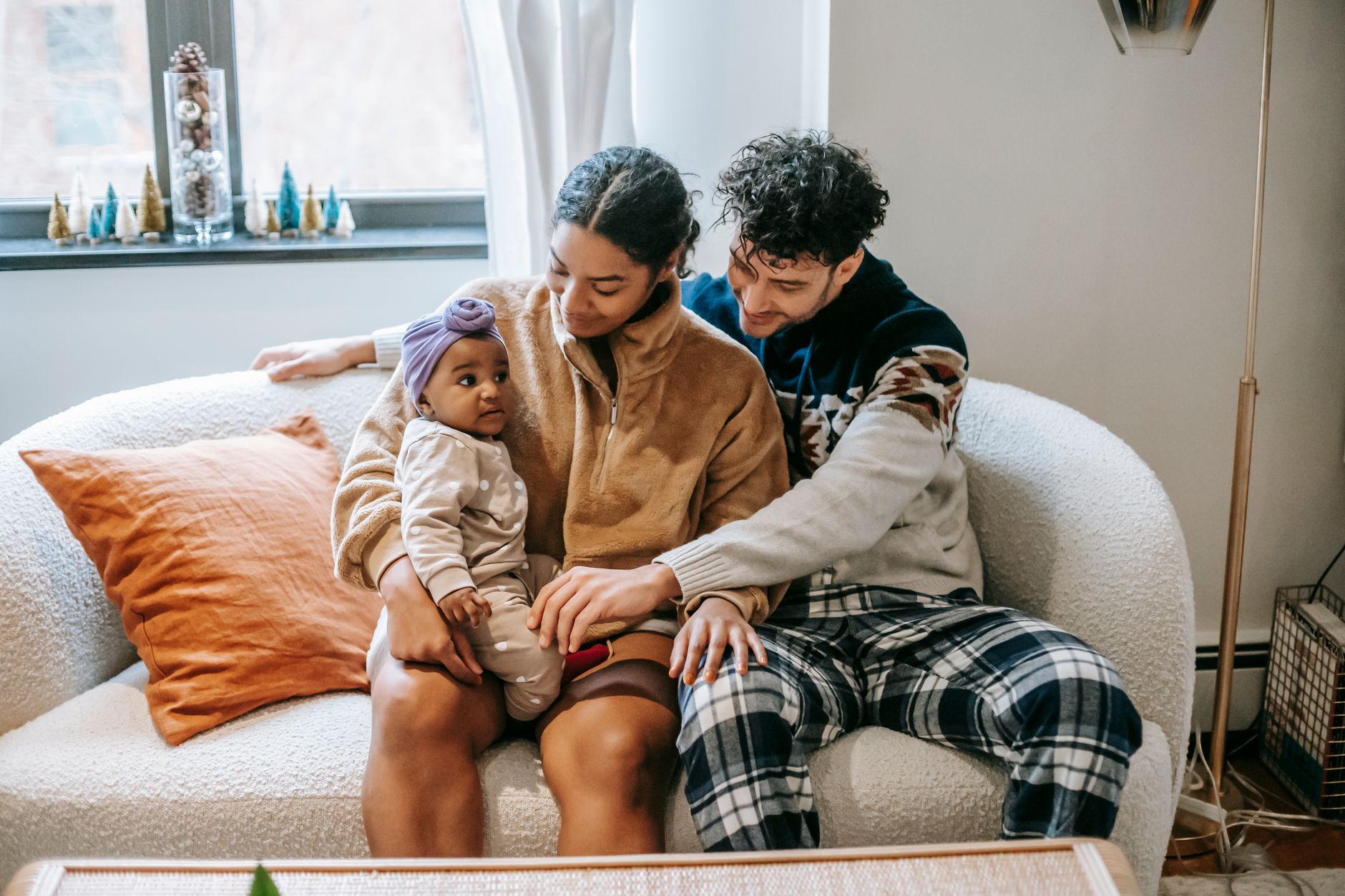 Dad and mom sharing baby care