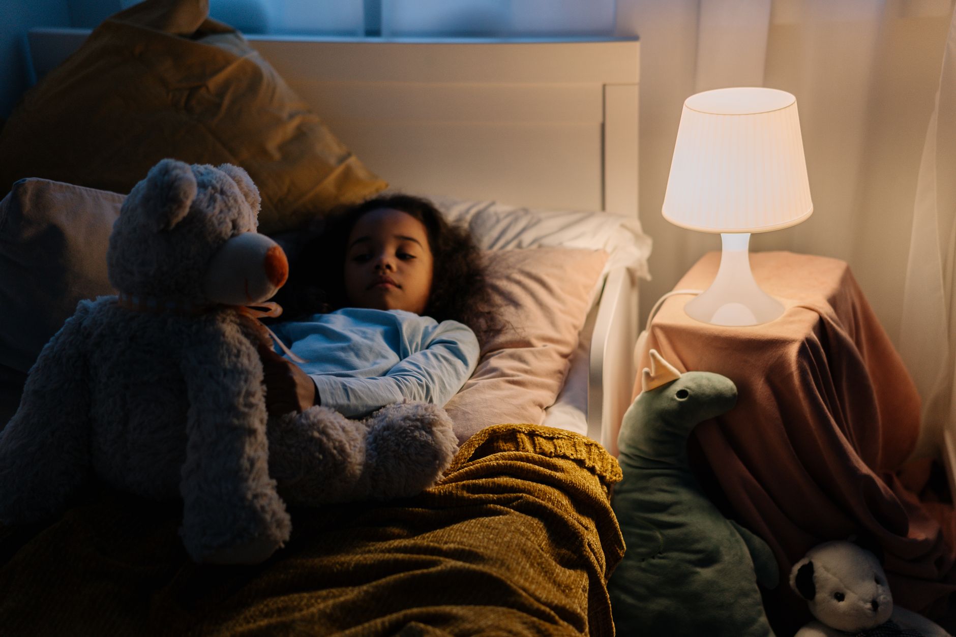 Bedtime scene with nightlight and plush toy