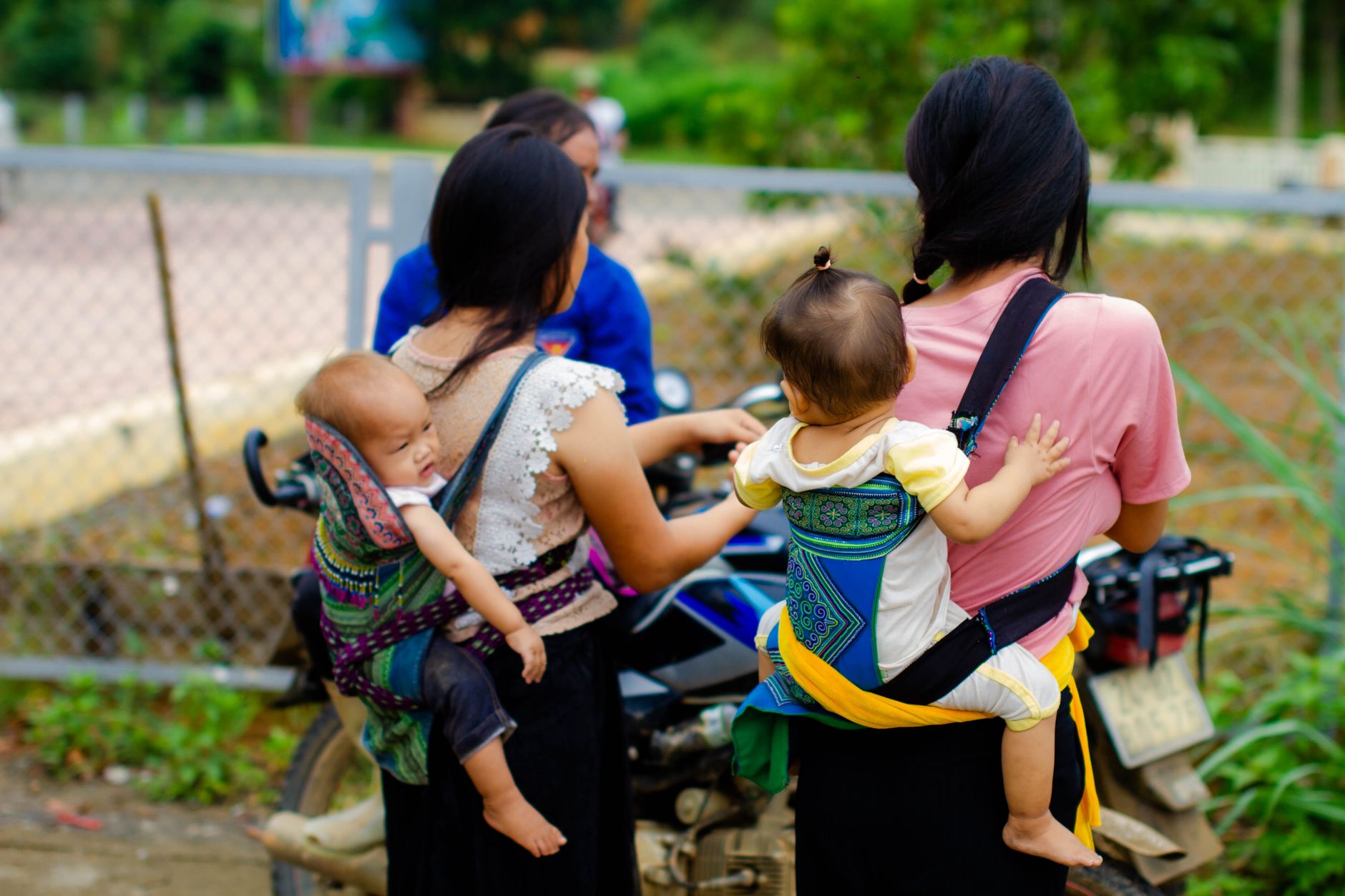 Babywearing instructor demonstrating proper positioning
