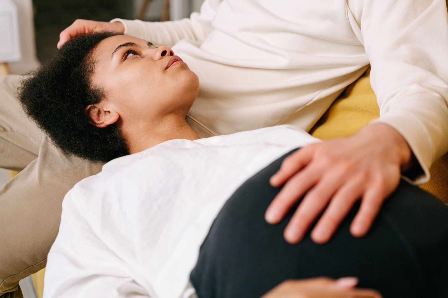 Pregnant woman using pregnancy pillow